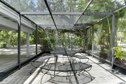 Outdoor gathering space in front screened in Lanai