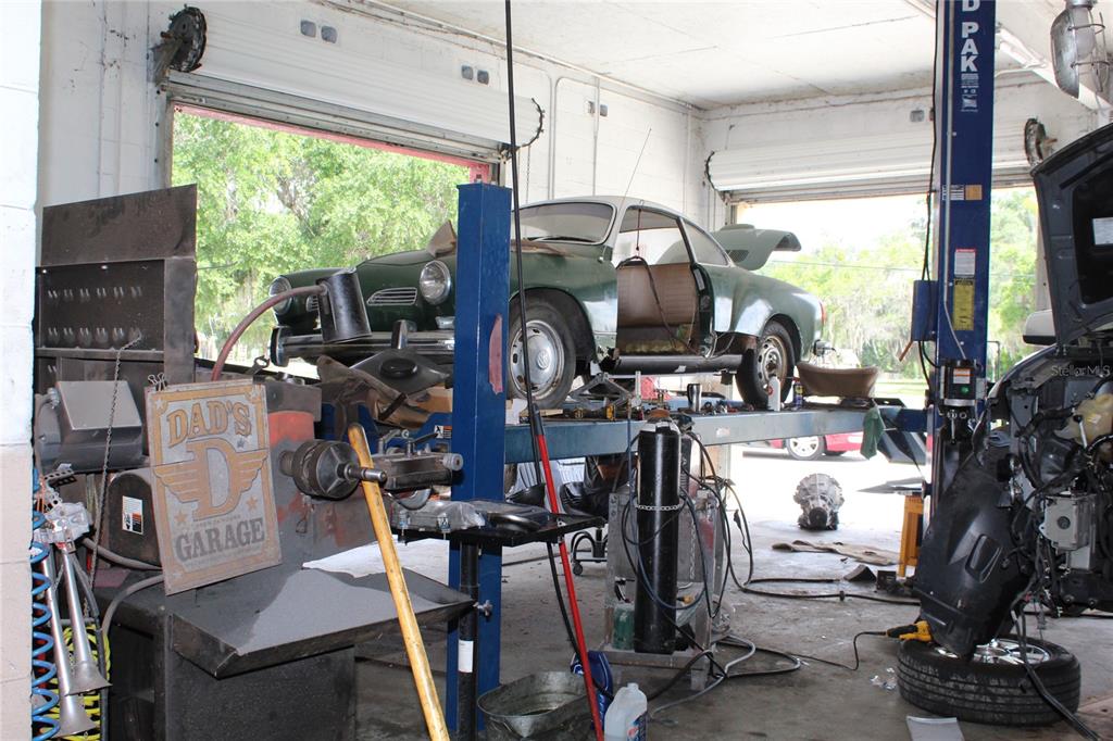 Back garage with three lifts. Truck area