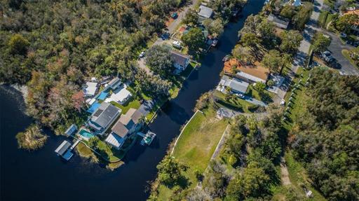 Over the top of the property with the canal and neighboring properties.
