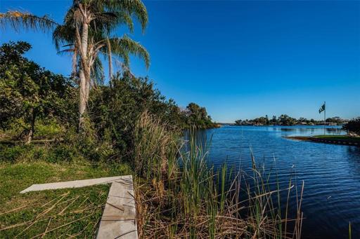 Facing East, towards Lake Tarpon, Standing on the seawall. 