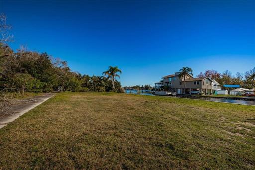 Facing East from the driveway displaying the property size.