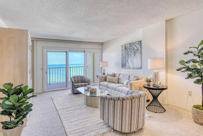 Living Room with hurricane impact sliders opening to your 32' open air balcony.