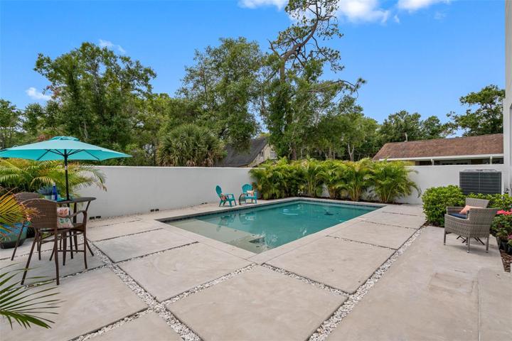 Contemporary concrete pavers back yard with 30’ x 15’ swimming pool. Dine outside or plunge into the beautiful swimming pool will cool you down on those hot summer days.