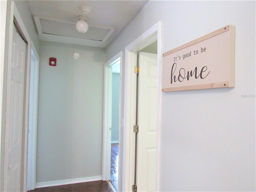 Hallway to guest bath, second and third bedroom