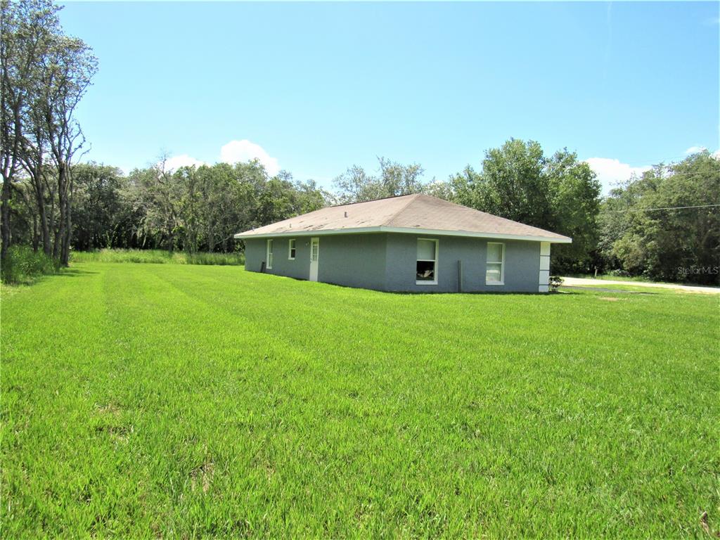 Exterior left side. Property has  4 lots