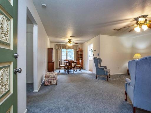 Entry way with view of living room and dining room.