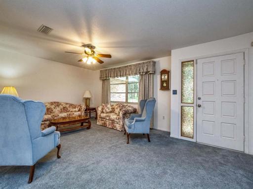 View of formal living room and front entry door