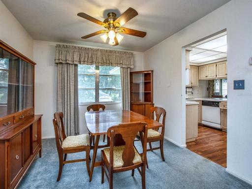 Formal dining room with entry way into kitchen