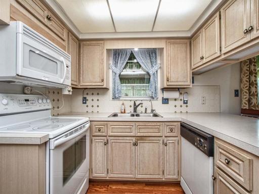 Kitchen with window out to florida room