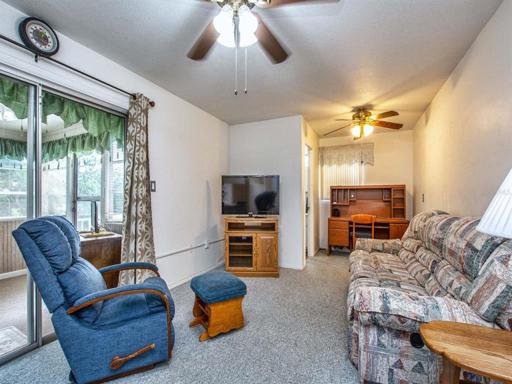 Family room with room for a desk and sliders out to florida room