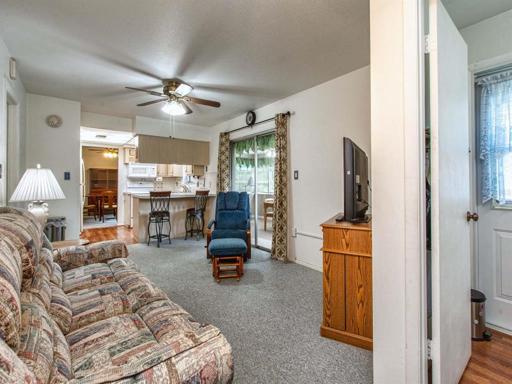 Family room view from desk area.  Half bath with exterior door off desk area