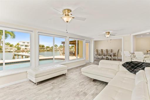 Enclosed Florida room looking toward canal and dock