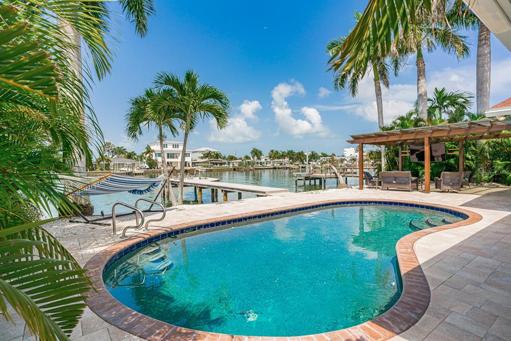 Pool area on canal looking toward outdoor entertainment area