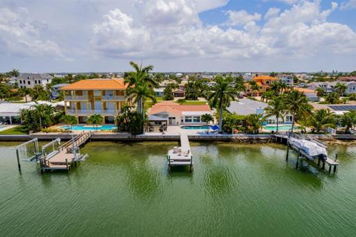 Aerial rear view of home from canal