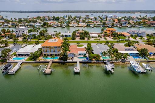 Aerial rear of home from canal looking east toward Intracoastal