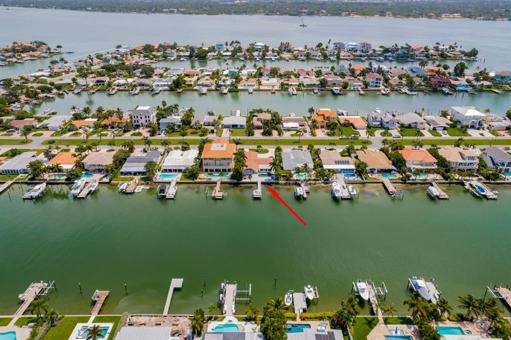 Aerial rear of home from canal looking east toward Intracoastal