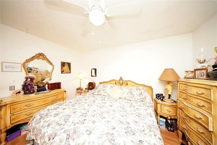 Master Bedroom with Newer Water-Resistant Vinyl Flooring, Ceiling Fan, and Closet that is almost as wide as the room.