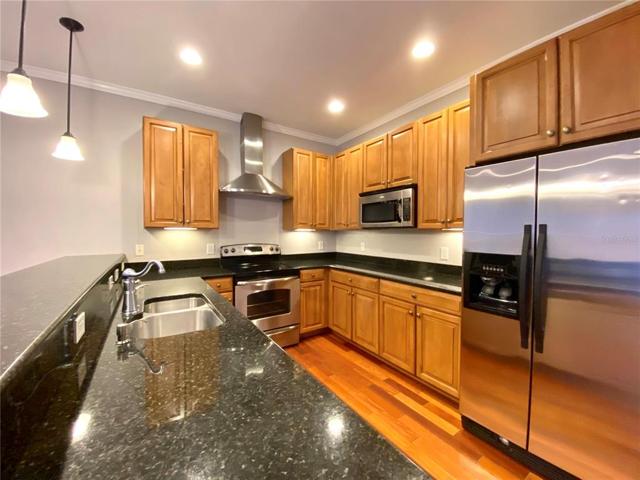 Kitchen with granite counter tops, stainless steel appliances, and