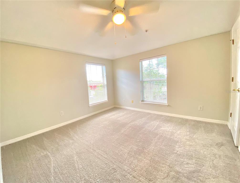 Third bedroom with walk in closet and new carpets