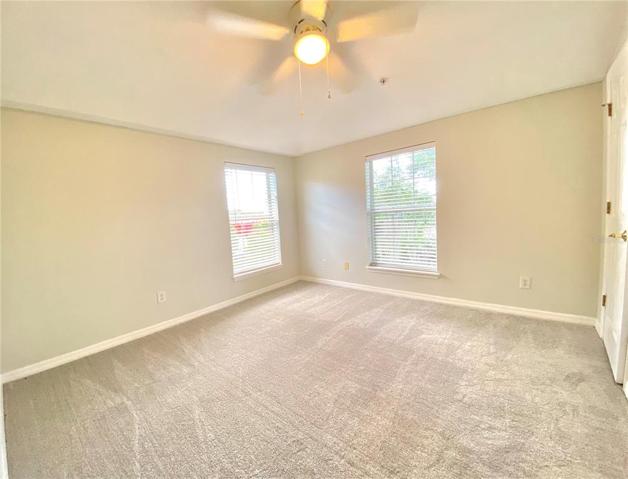 Third bedroom with walk in closet and new carpets