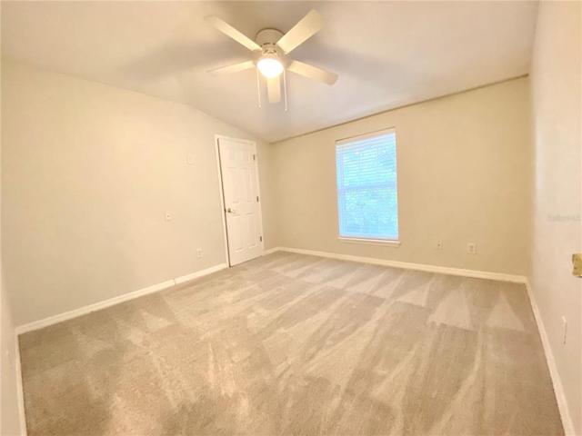 Second bedroom with walk in closet and new carpets