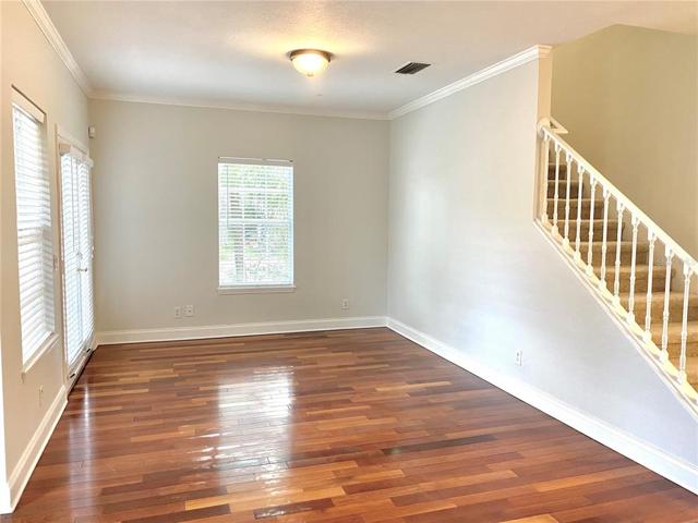 Living room with French doors that open to private patio