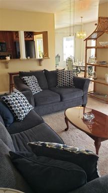 Spacious living room with sliders and natural light