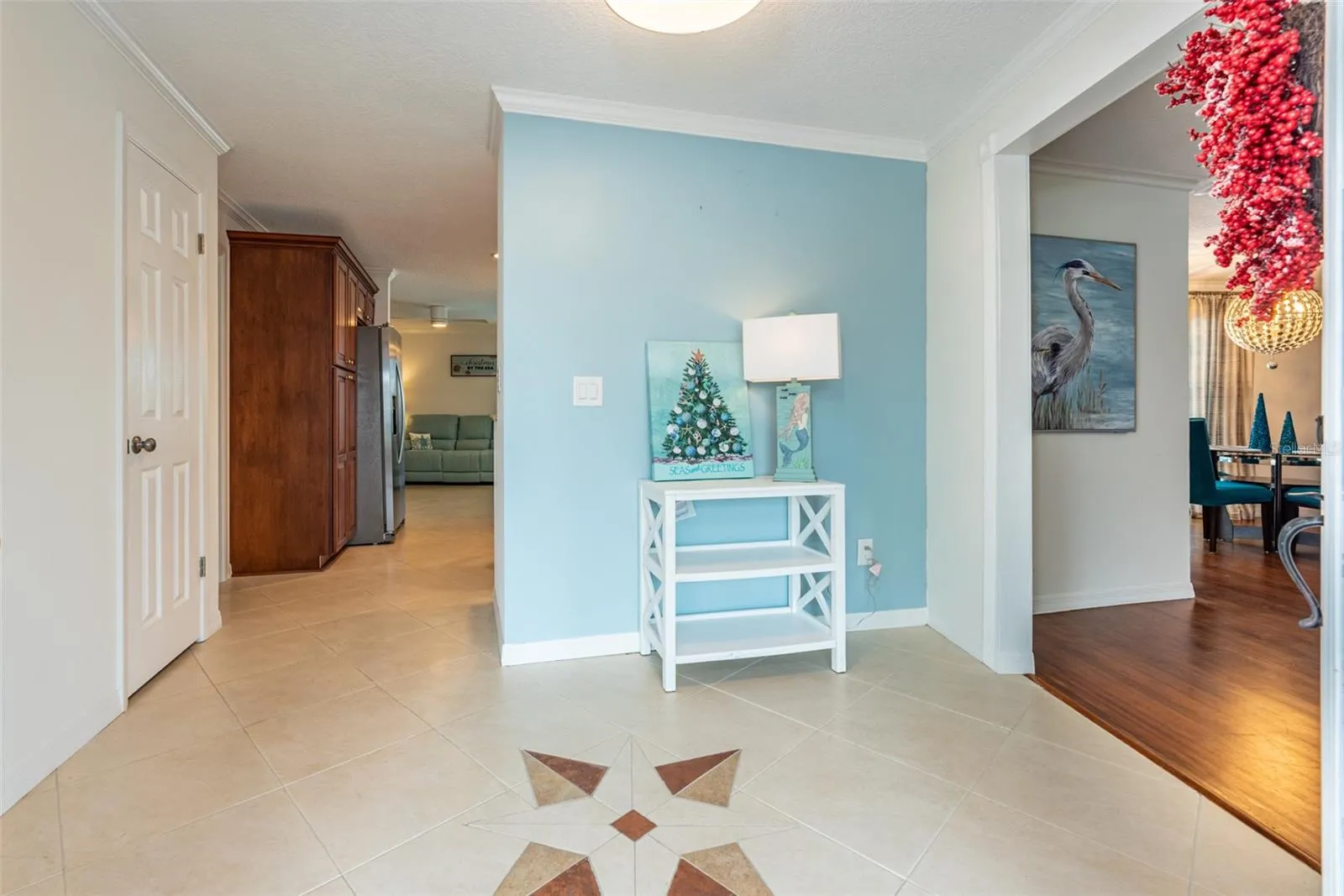 Entryway.  To the right is the formal living/dining area.  Straight ahead is the family room with the kitchen behind the half wall.