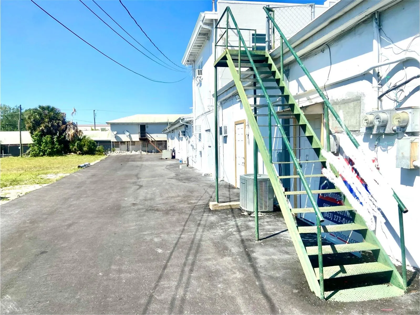 rear of building with extra parking lot