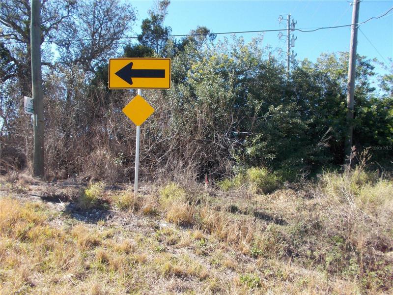 SHARP CURVE AT END OF MAMMOTH ROAD/ON THE RIGHT IS THE EASEMENT RD.
