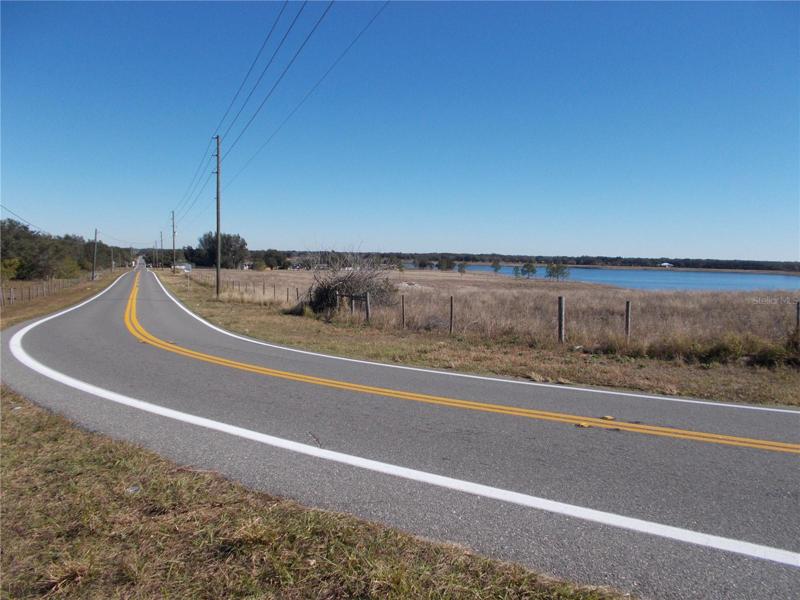 PROPERTY IS ACROSS FROM THIS LAKE IF  YOUR STANDING ON EASEMENT RD