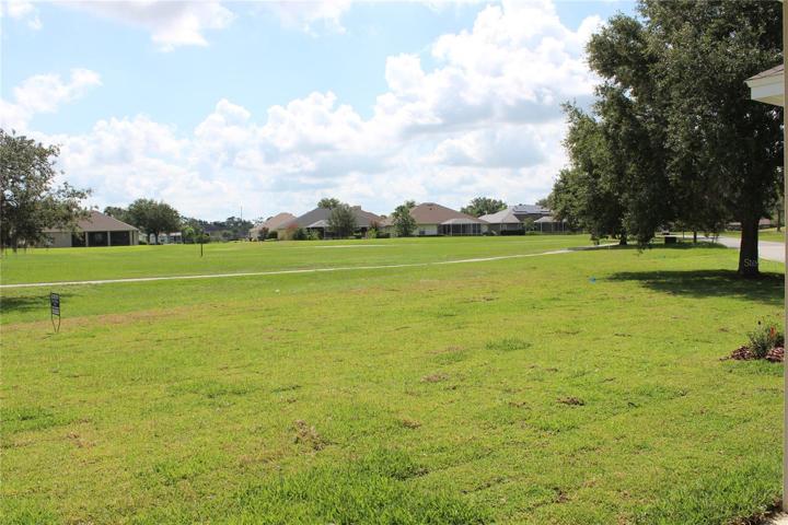 Expansive yard and golf course view