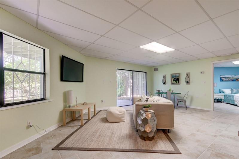 View Into Family Room/Game Room From Doors. Bedroom in the Rear.