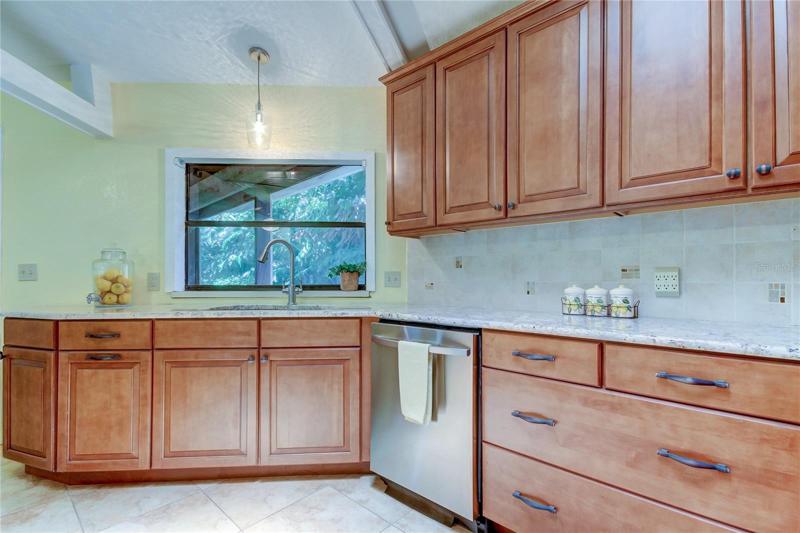 Kitchen; Window View to Porch and Back Yard
