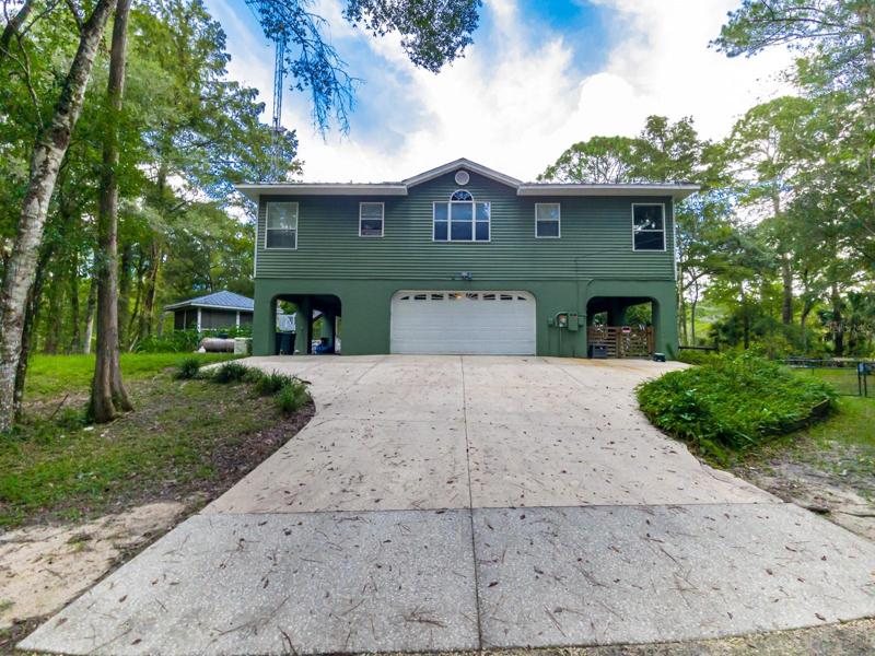 View of house & driveway OM645418 10599 N SILVERLAKE PT, DUNNELLON, FL 34434