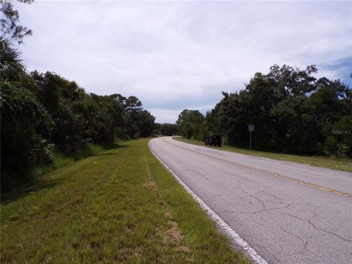 Facing Southwest looking down De Leon Dr