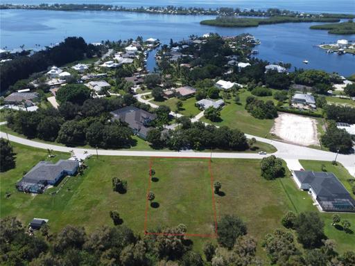 Aerial view of property showing ocean nearby with approximate boundaries