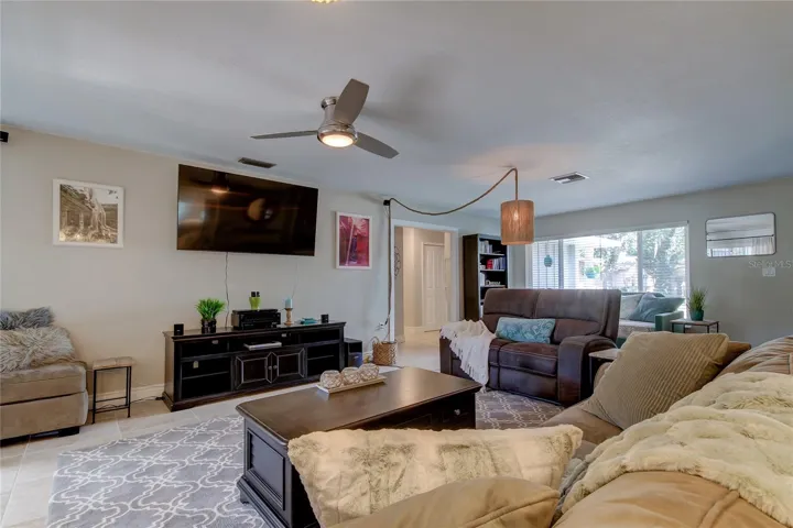 Living room features a brand new 65- in Smart TV with streaming service (Living Room 18.3 x 24.4)