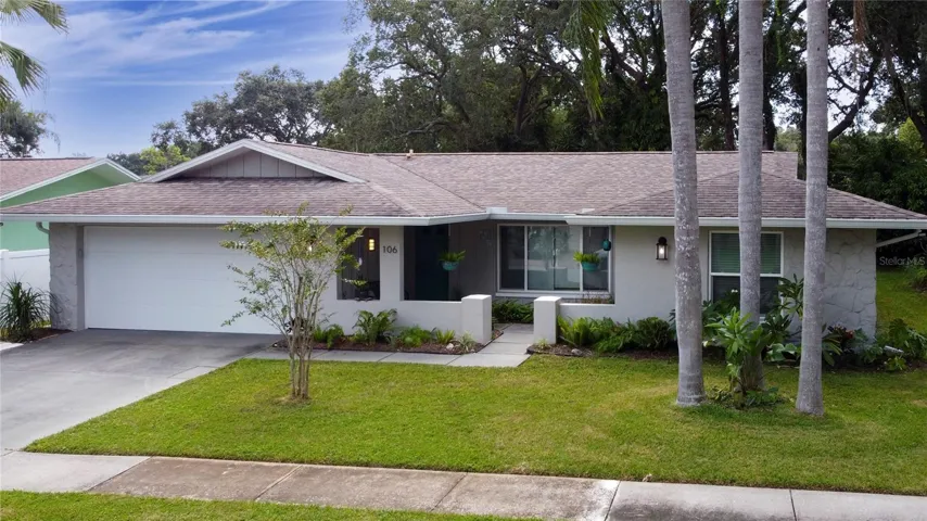Beautiful Palm Trees in the front yard reminding you that you are in Florida