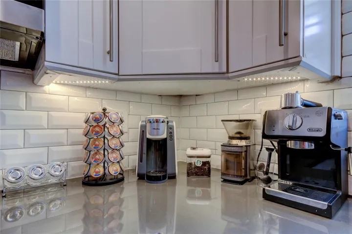 Well stocked coffee and tea station Drip coffee Kcups or make yourself a latte Delonghi Expresso