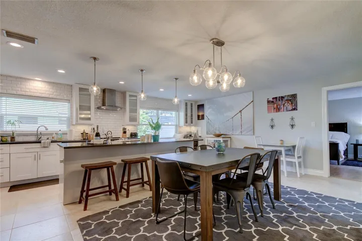 Dining area (9.4x19 ) is supplemented by a 12' breakfast bar with stoles