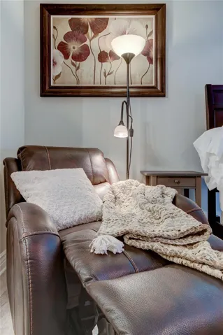 Cozy leather electric recliner with luxurious throw to snuggle up and watch tv