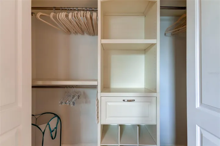 Well designed built out closet for maximum storage .. velvet hangers included