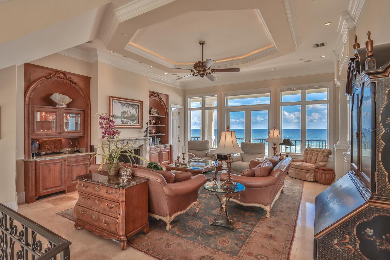 Great room with fireplace, wet bar, art covered media and great viewsLevel 2