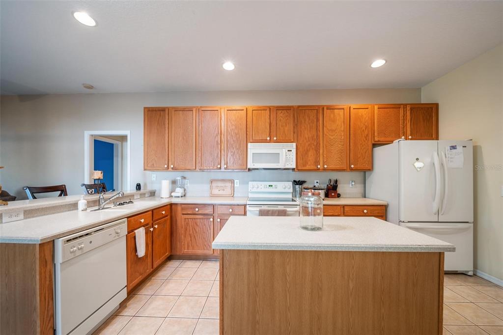 View into Kitchen with Island in kitchen.