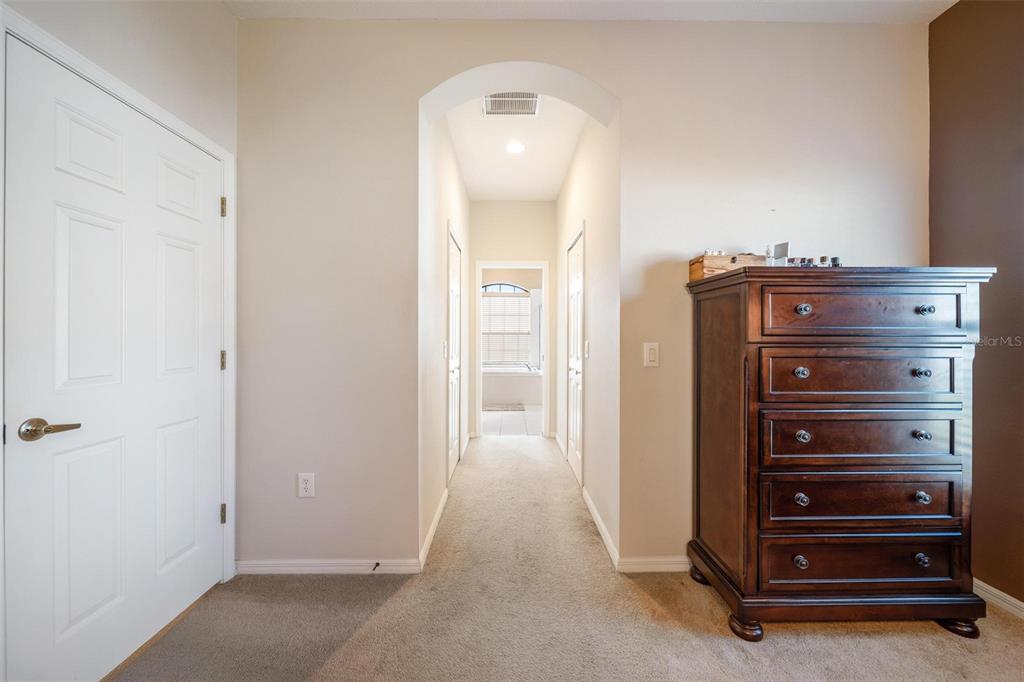 Primary bedroom view going into masterbathroom