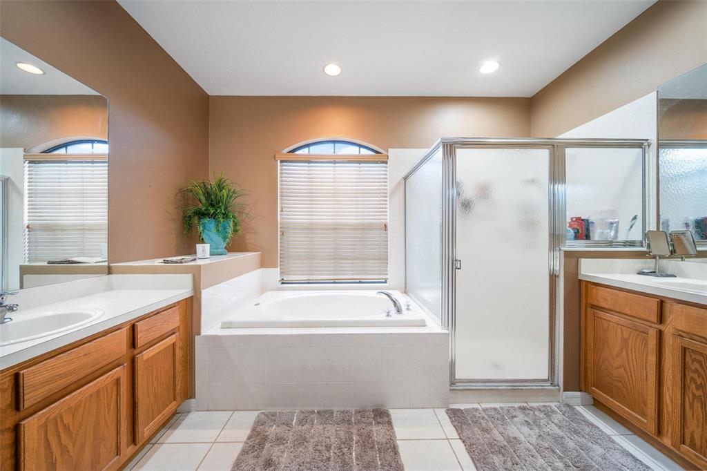 Master Bathroom offers dual sinks and sep tub and shower