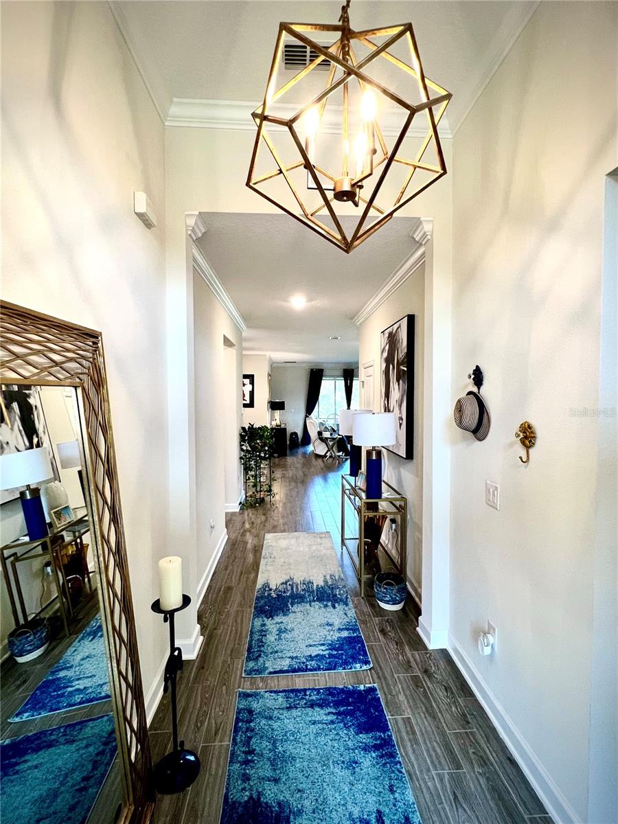 Custom lighting and 12' ceiling in the foyer