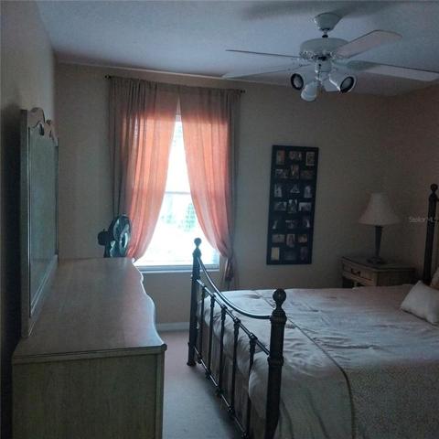 The third bedroom has a nice view of the pool and the pond