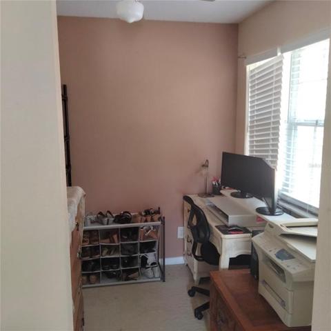 The large master bedroom has a large walk-in closet and a second are that could be a closet, nursery, office, or sitting room